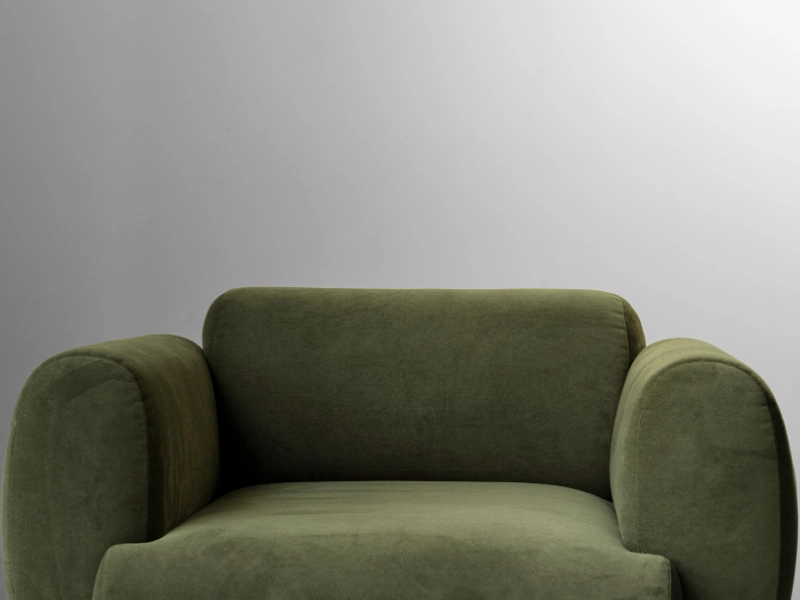 Sillón de un cuerpo tapizado en tela clara